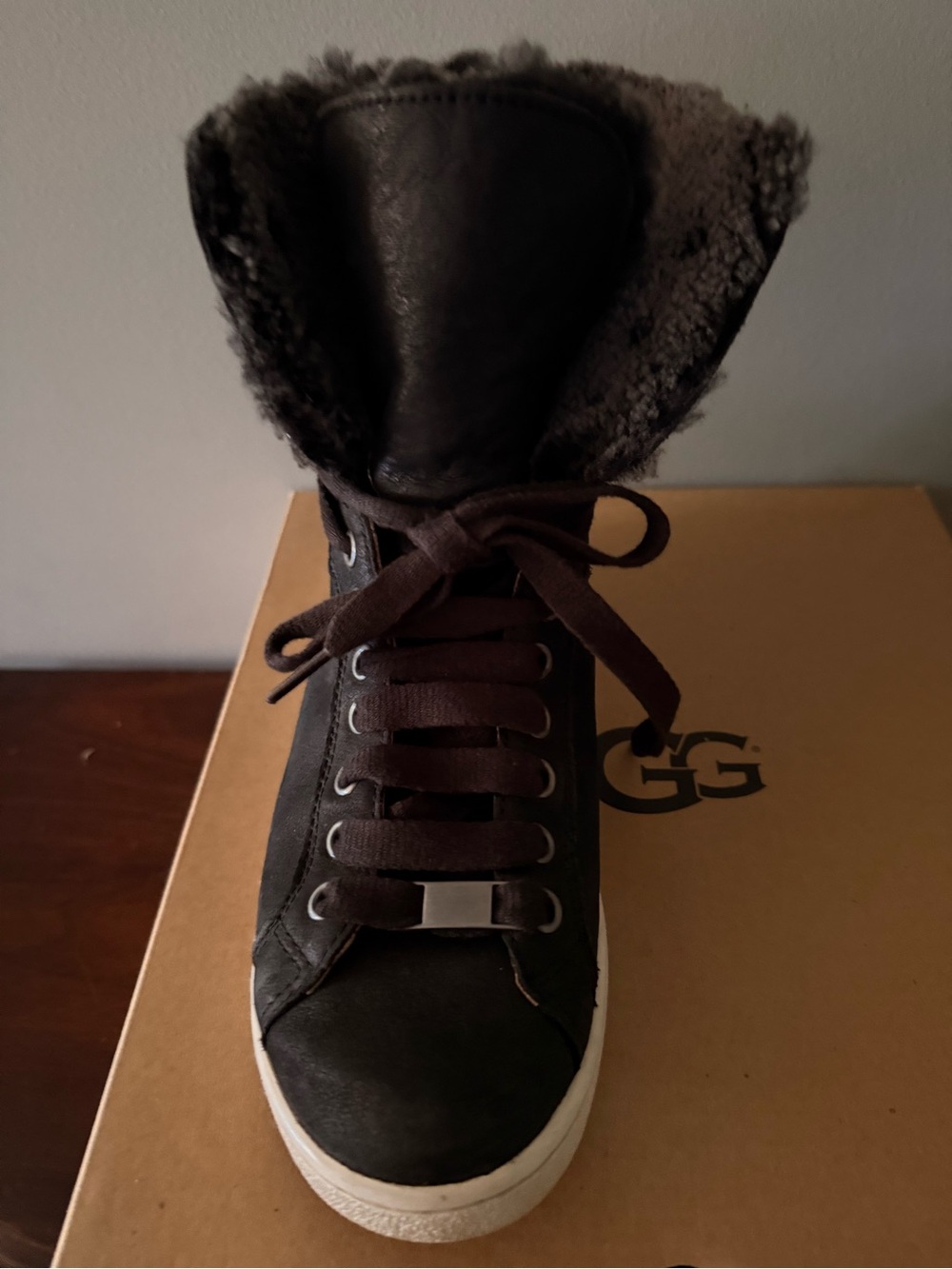 Ugg women’s Starlyn black high top tie sneakers. Size 8. Grey fur interior